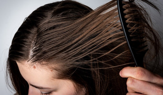 woman brushing her hair